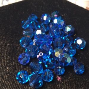 Various shapes and sizes of blue crystal beads